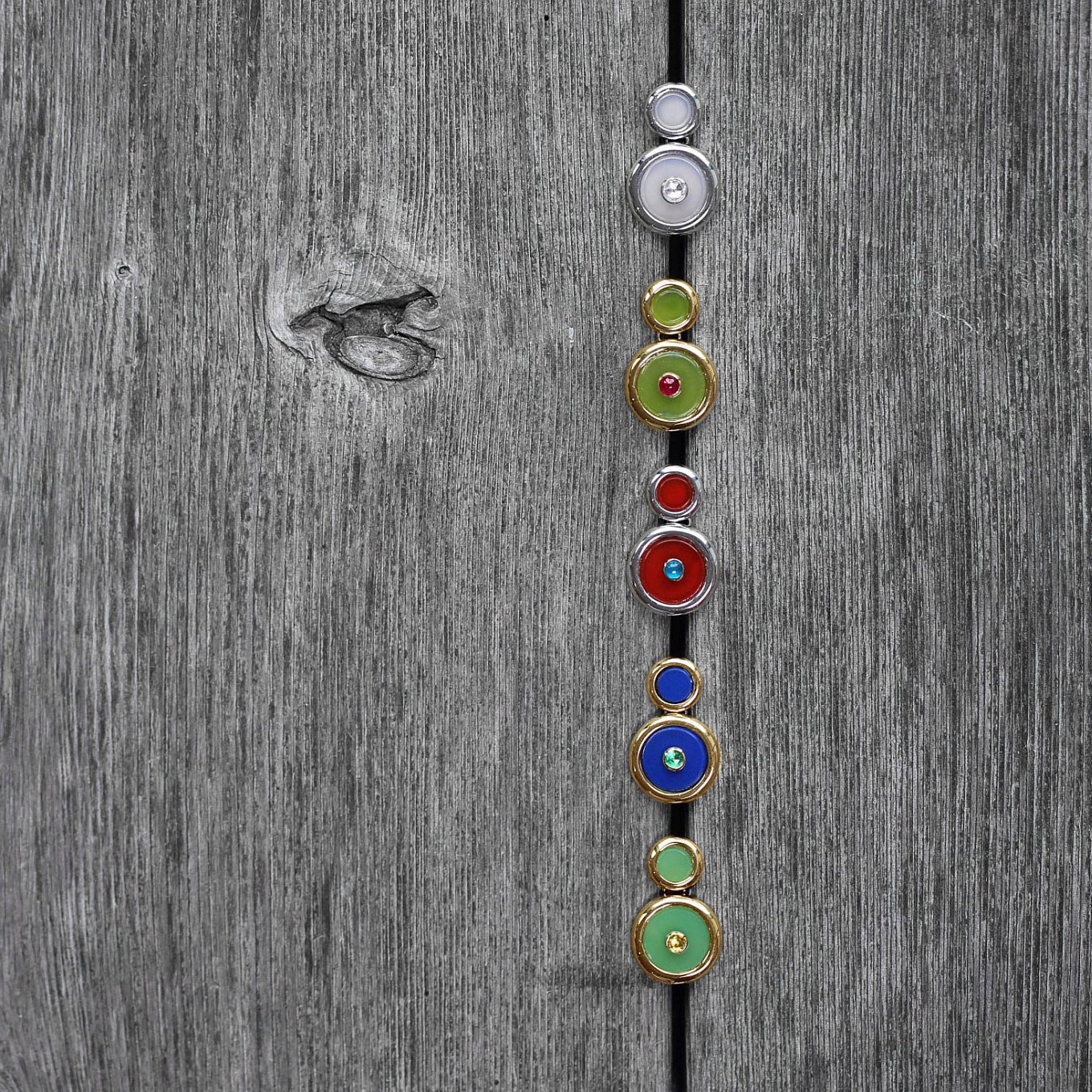 “Button“ earrings with hardstone discs & gemstones in gold from top:   Chalcedony & rose cut Diamond in white gold -  Jade & rose cut Rubies in yellow gold -  Carnelian & Apatite in white gold -  Lapis & Emerald in yellow gold - Chrysoprase & Yellow Sapphire in yellow gold