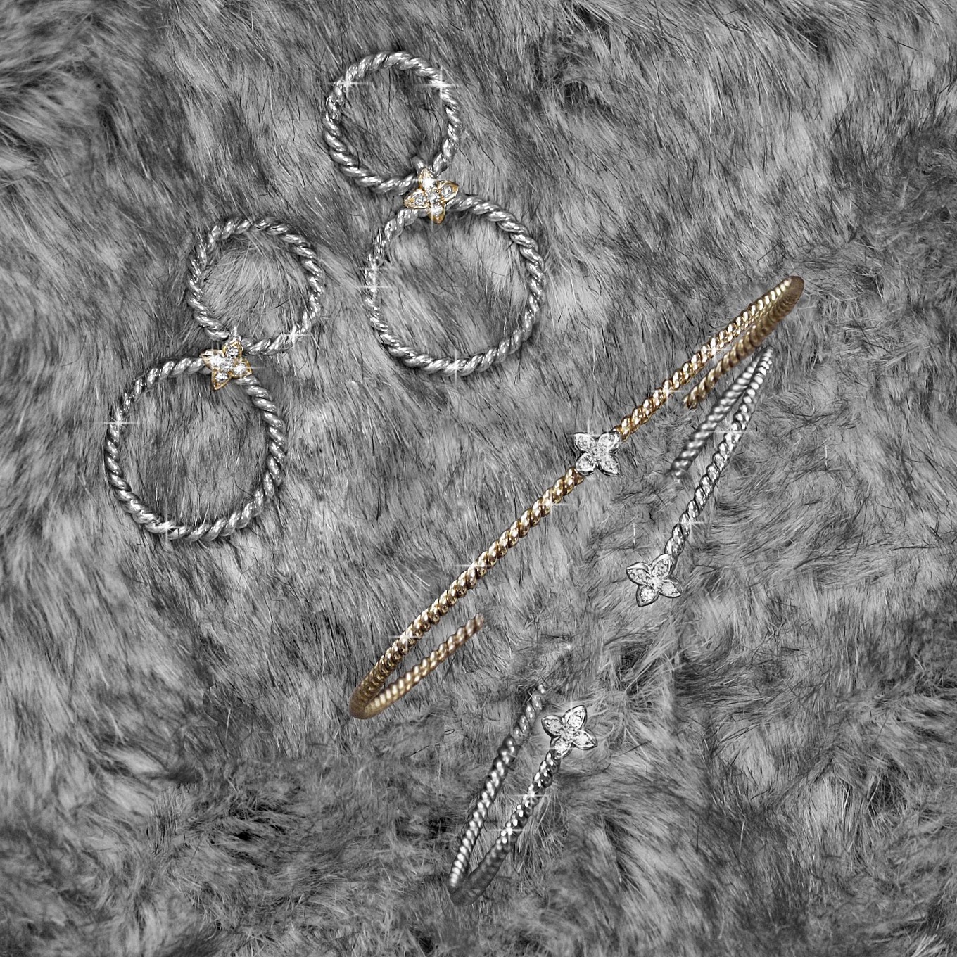 Sterling silver Braided Double hoop earrings with diamond sevilla motif in yellow gold.From a selection of Sevilla Braid cuffs & bangles in silver, gold & diamonds.Yellow gold braid cuff with one sevilla diamond motif.White gold braid cuff with two sevilla diamond motif.