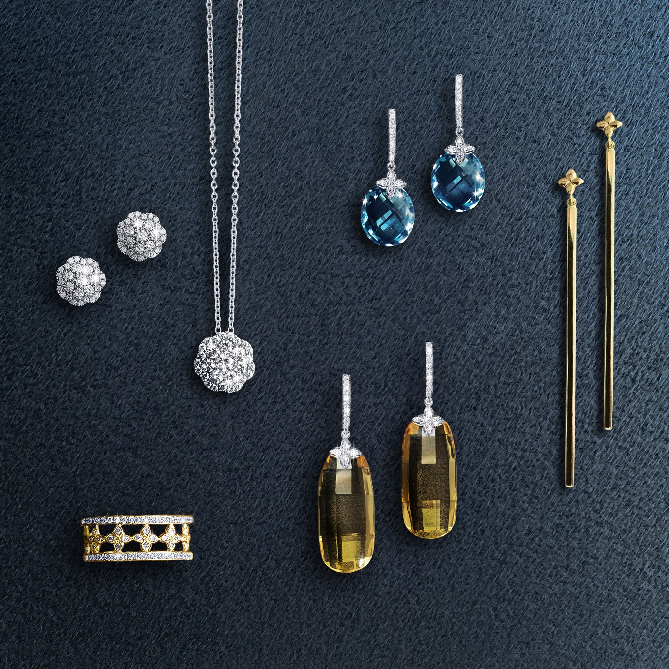 From left<br/><br/>Sevilla diamond eternity band in yellow gold<br/><br/>Cluster diamond earrings<br/><br/>Cluster diamond pendant<br/><br/>Barrel shaped checkerboard Citrine & sevilla Diamond earrings<br/><br/>Oval checkerboard blue topaz sevilla Diamond drop earrings<br/><br/>G series "2.1" earrings in yellow gold